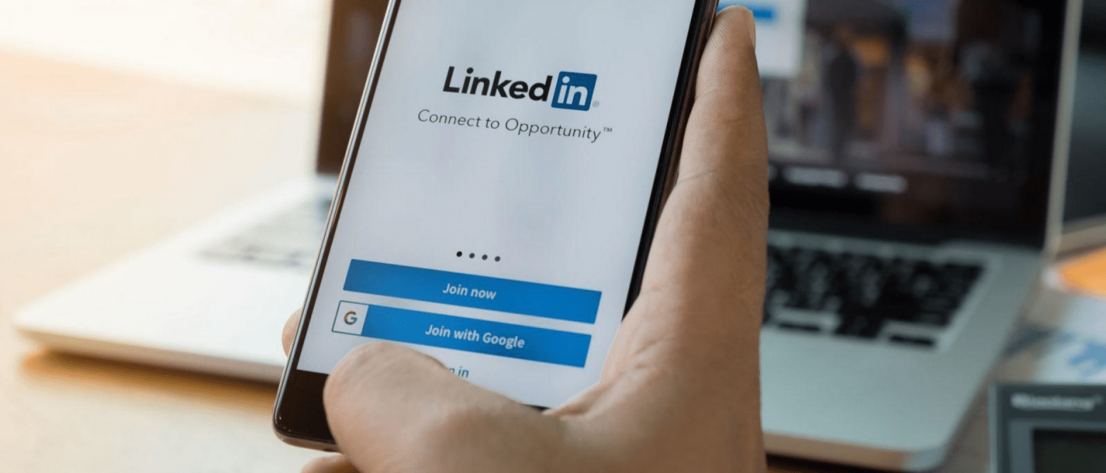 man using mobile phone for linkedin conversion tracking