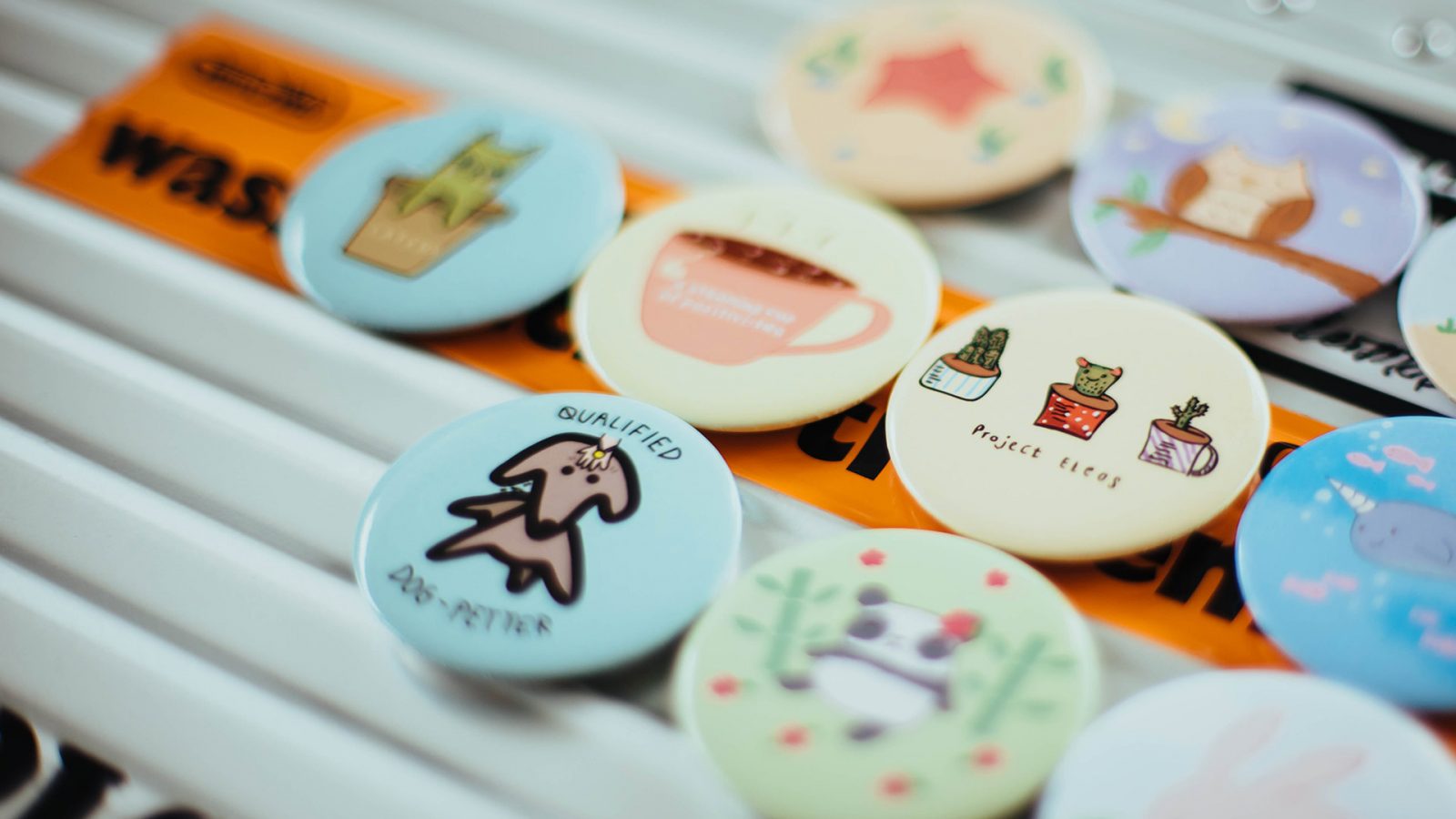 badges with illustrated graphics on them