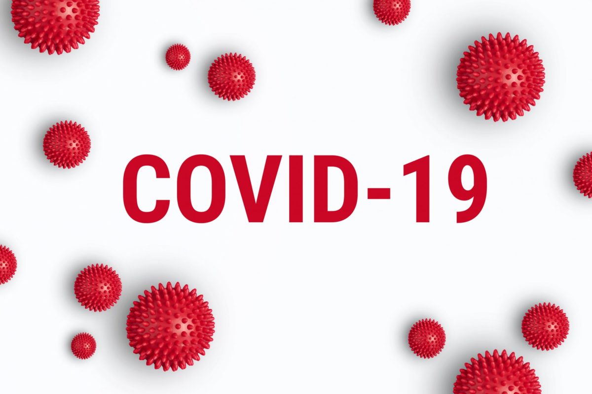 COVID-19 text with virus shaped balls around