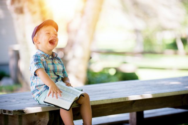 young boy laughing