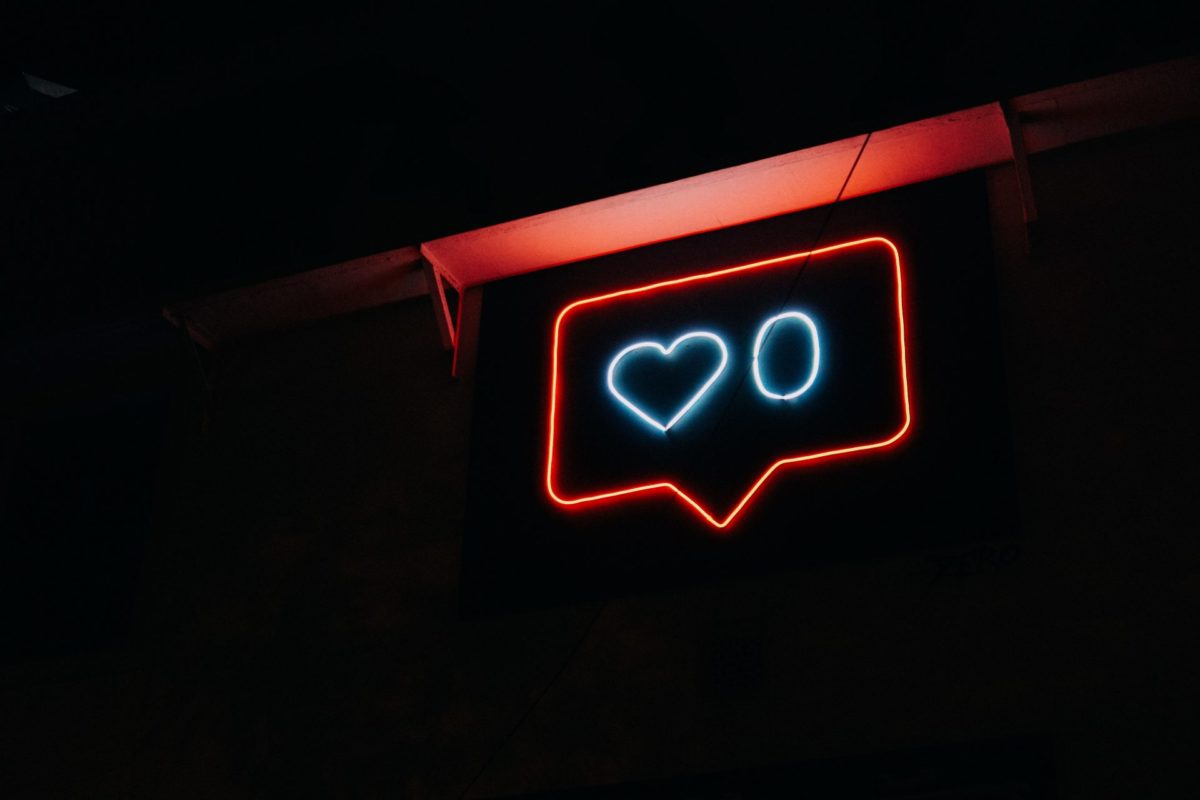 social media comment sign lit up as a neon light