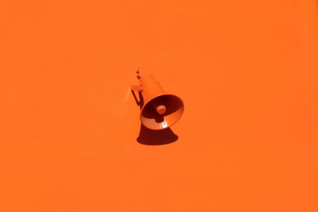 orange megaphone on orange background